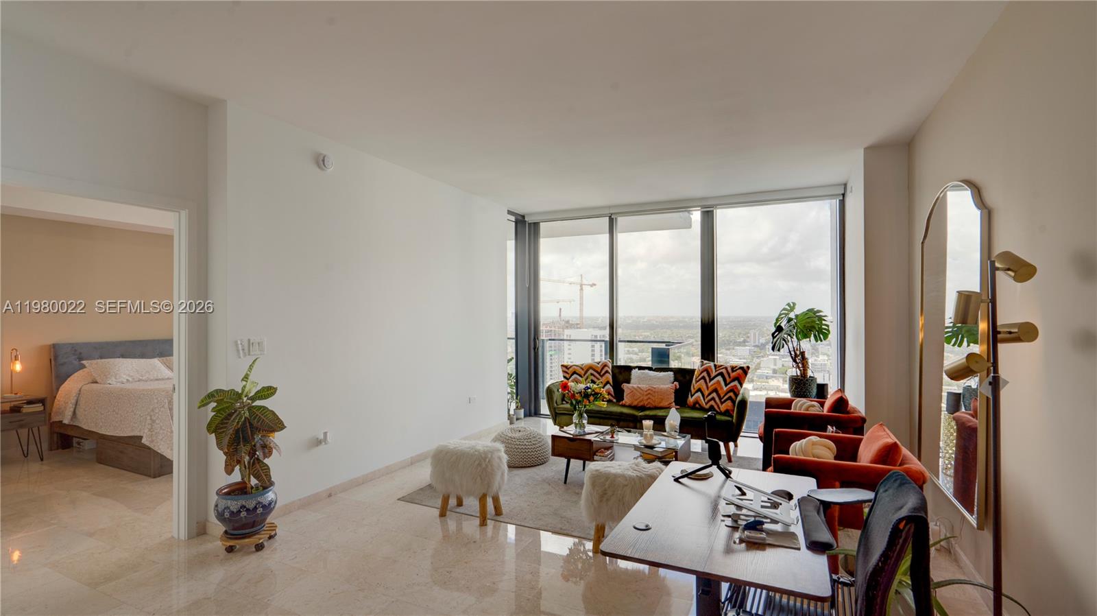 88 Southwest 7th Street, Unit 2706 Miami, FL 33130 - Photo 21 of 58 a living room with furniture and a large window