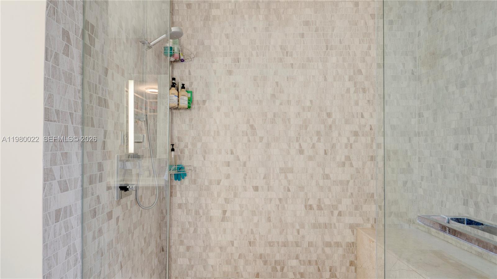 88 Southwest 7th Street, Unit 2706 Miami, FL 33130 - Photo 32 of 58 a bathroom with a shower