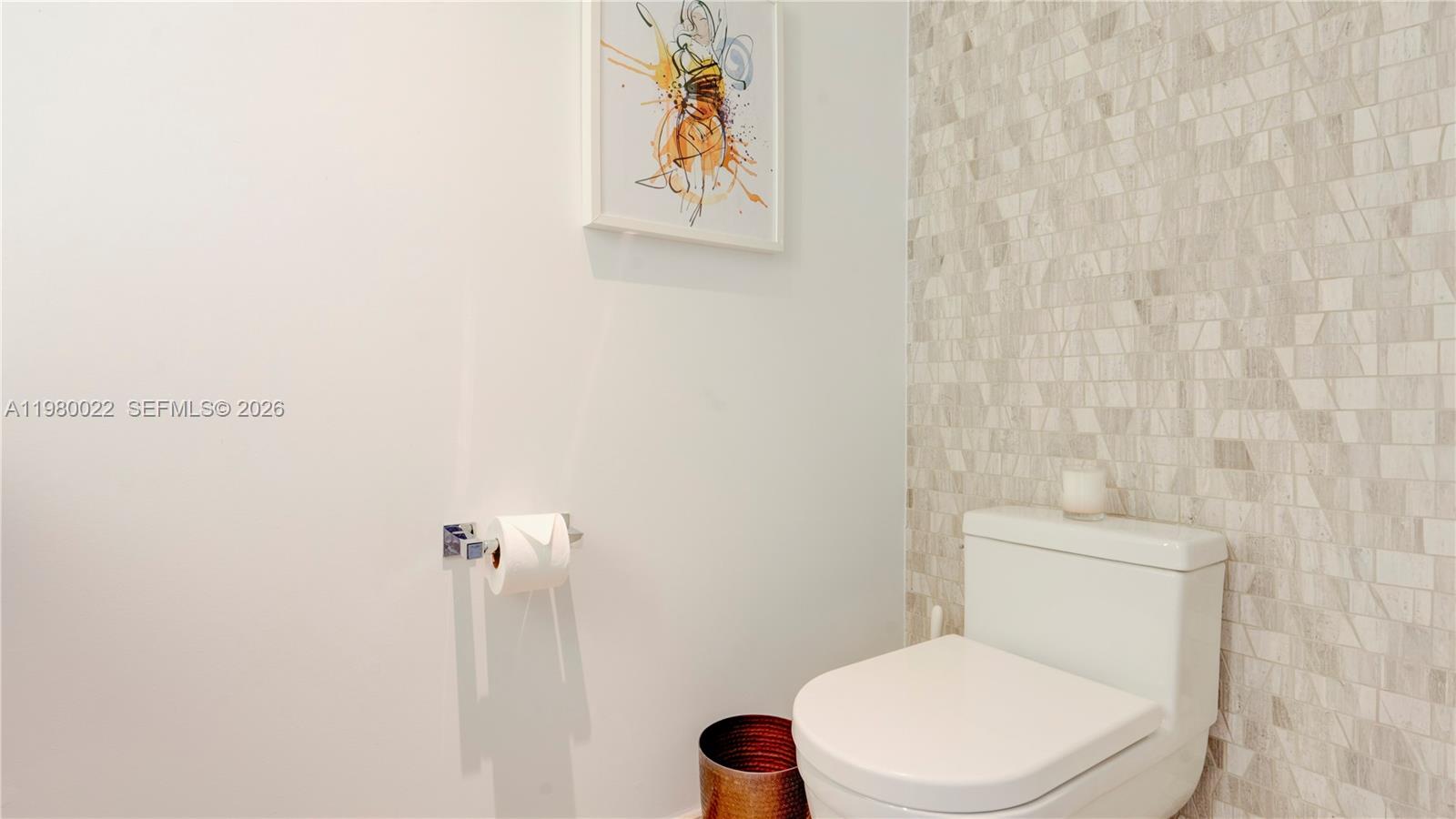 88 Southwest 7th Street, Unit 2706 Miami, FL 33130 - Photo 39 of 58 a white toilet sitting next to a shower