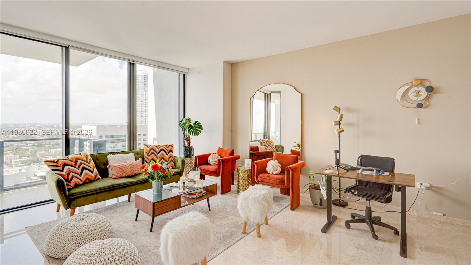 88 Southwest 7th Street, Unit 2706 Miami, FL 33130 - Photo 4 of 58 a living room with furniture and floor to ceiling windows