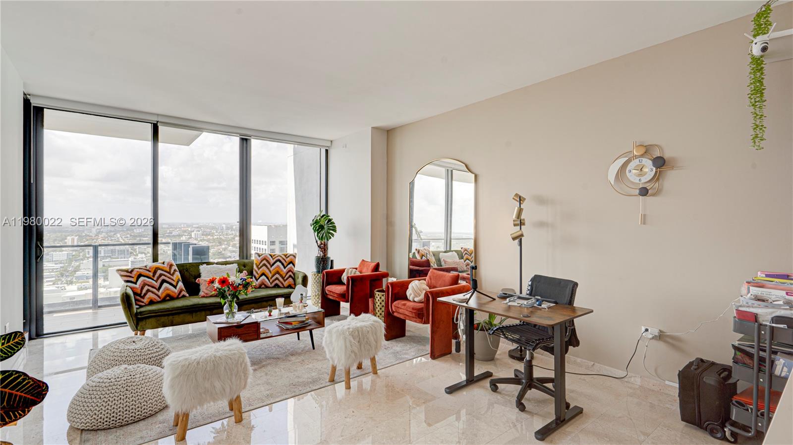 88 Southwest 7th Street, Unit 2706 Miami, FL 33130 - Photo 5 of 58 a living room with furniture and a large window
