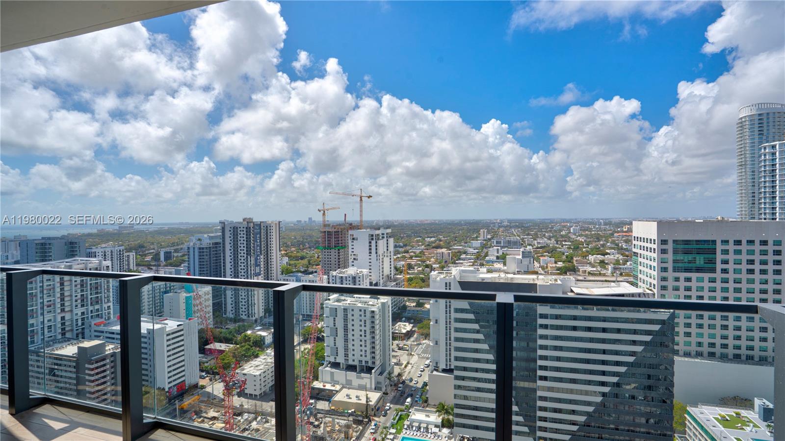 88 Southwest 7th Street, Unit 2706 Miami, FL 33130 - Photo 8 of 58 a view of a city from a balcony