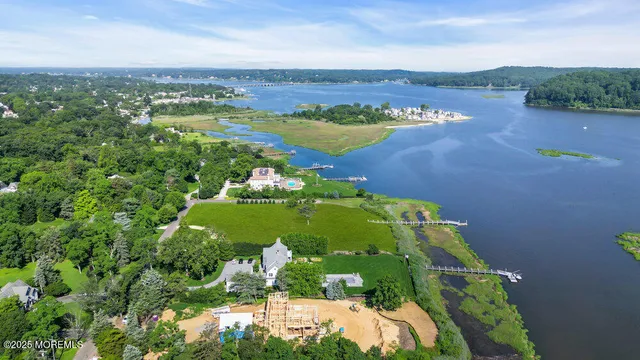 an aerial view of a houses with a yard