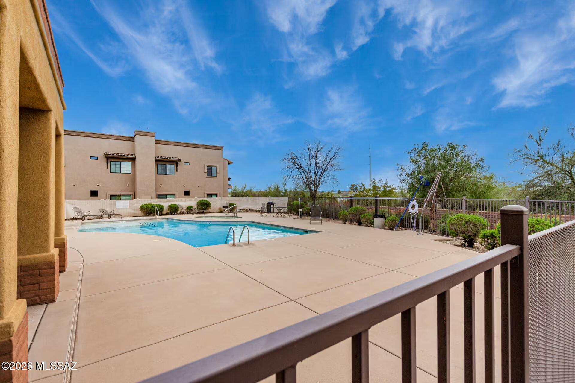 2036 East River Road, Unit 104 Tucson, AZ 85718 - Photo 22 of 23 a view of an outdoor space and swimming pool