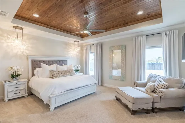 a bedroom with a bed couch and window