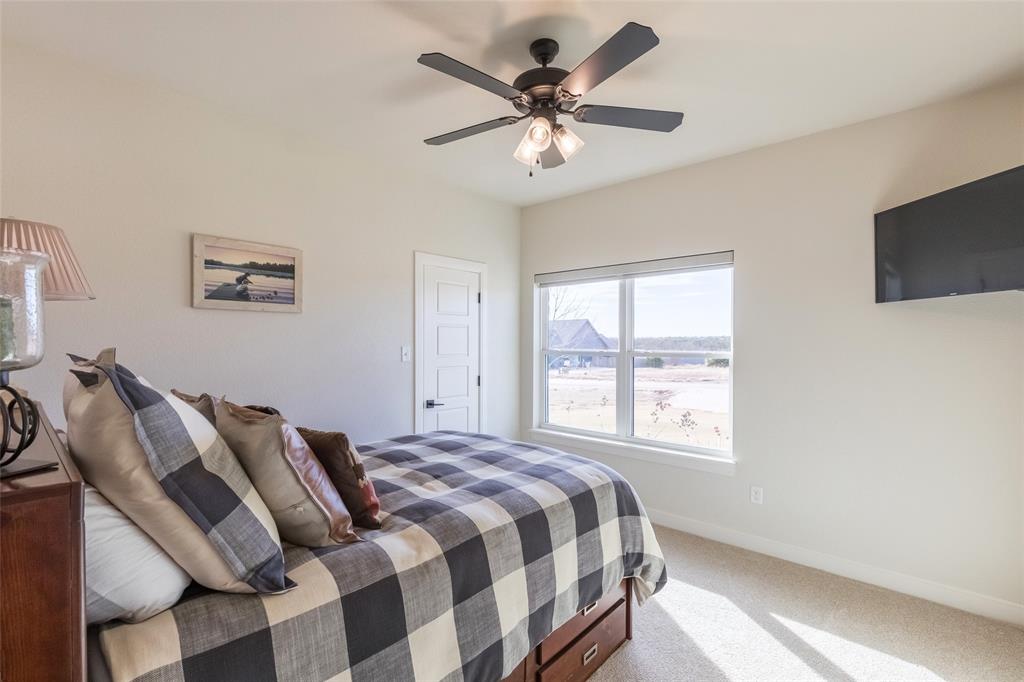 169 Pne Spgs Cove Tuscola, TX 79562 - Photo 17 of 40 a bedroom with a bed and a window