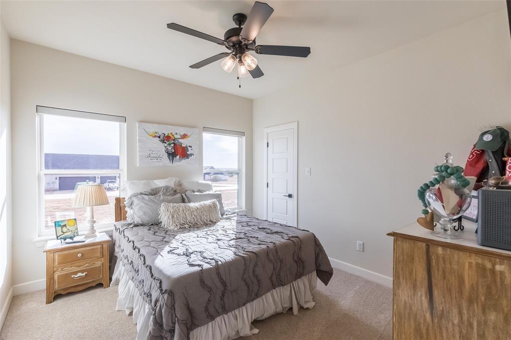 169 Pne Spgs Cove Tuscola, TX 79562 - Photo 21 of 40 a bedroom with a bed and a window