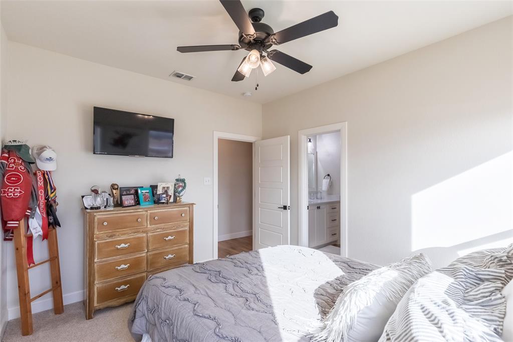 169 Pne Spgs Cove Tuscola, TX 79562 - Photo 22 of 40 a bedroom with a bed and a flat screen tv