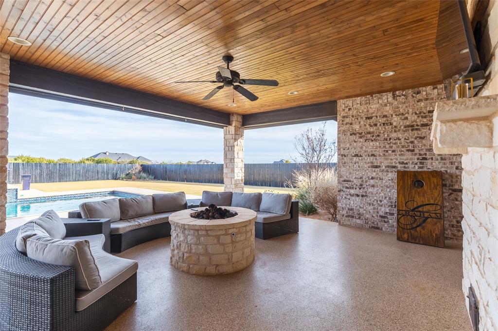 169 Pne Spgs Cove Tuscola, TX 79562 - Photo 28 of 40 a living room with furniture and a floor to ceiling window