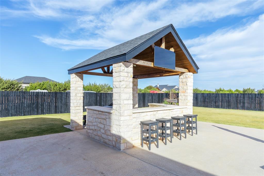 169 Pne Spgs Cove Tuscola, TX 79562 - Photo 32 of 40 a front view of a house with garden