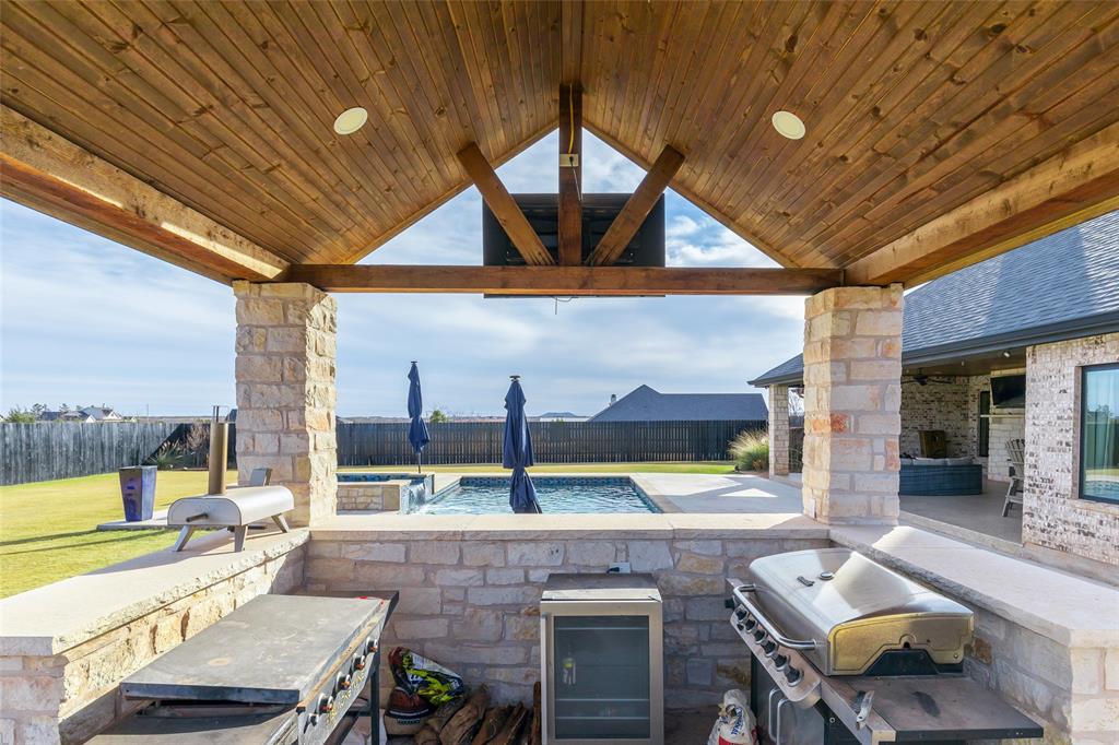 169 Pne Spgs Cove Tuscola, TX 79562 - Photo 33 of 40 a dining room with furniture and a floor to ceiling window