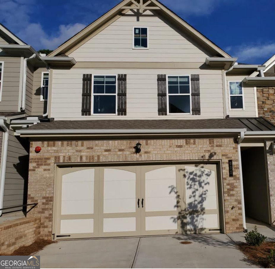 932 Exposition Pte Marietta, GA 30067 - Photo 1 of 8 a view of a front of house with garage