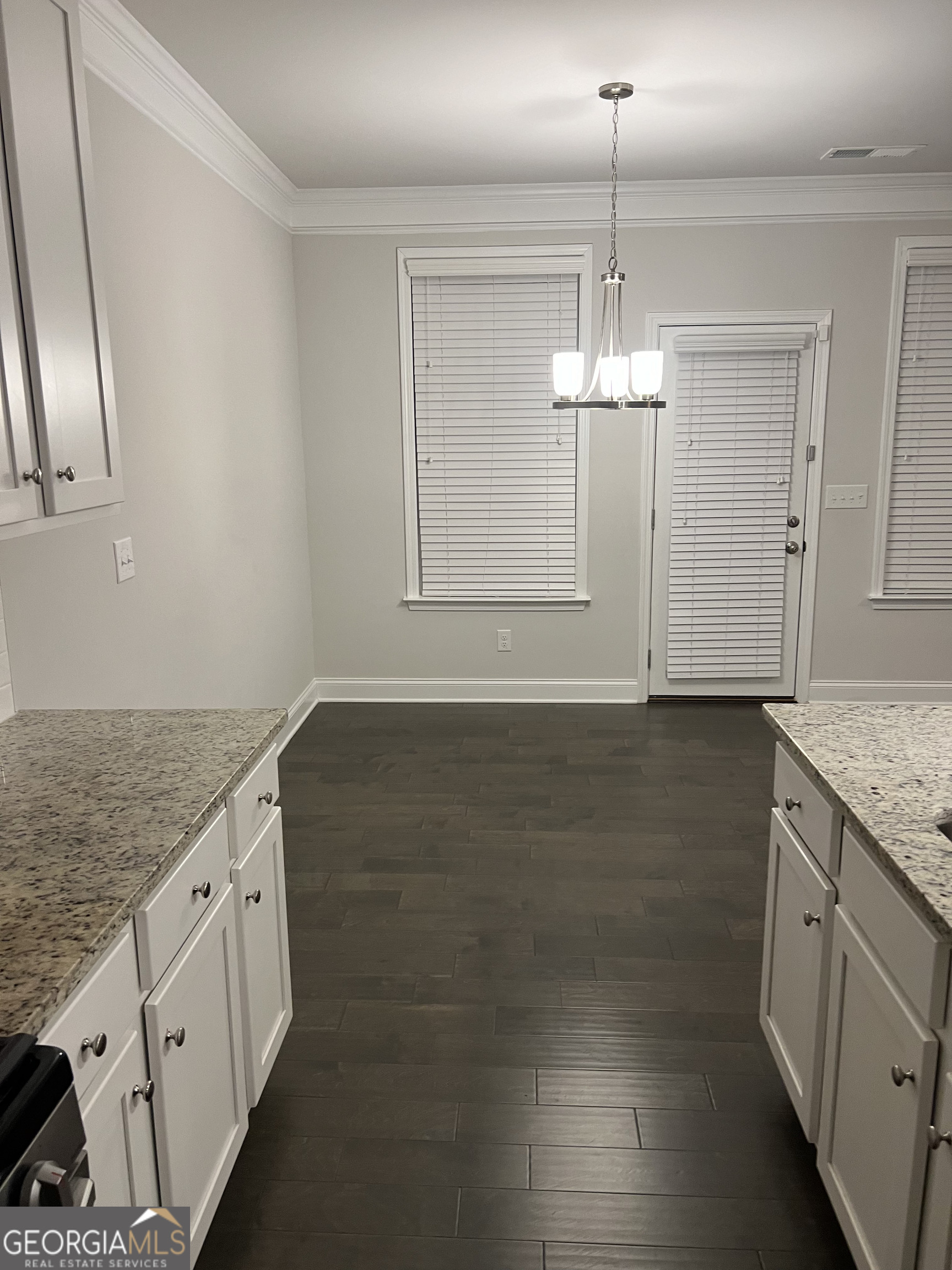 932 Exposition Pte Marietta, GA 30067 - Photo 6 of 8 wooden floor in an empty room with a window
