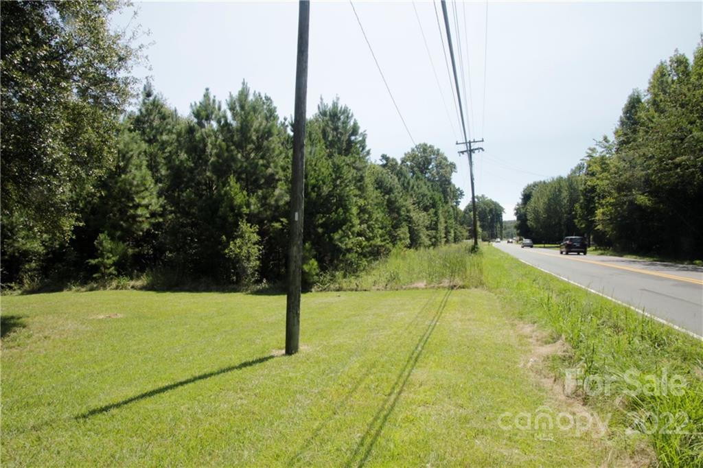 10003 Idlewild Road Matthews, NC 28105 - Photo 4 of 5 a view of a swimming pool with a yard
