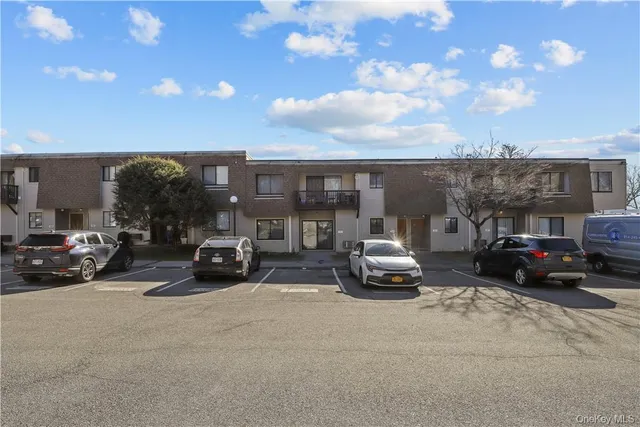 a view of car parked in front of a building