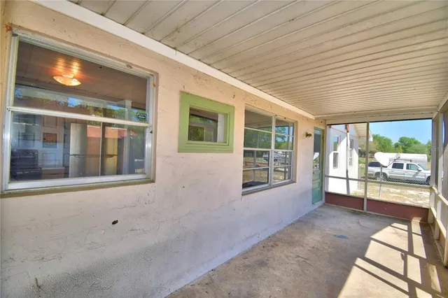 a view of a brick house with a large windows