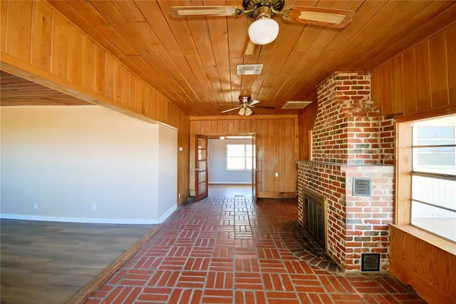 a kitchen with granite countertop stainless steel appliances and wooden cabinets