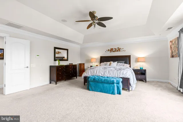 a bed room with a bed and dresser