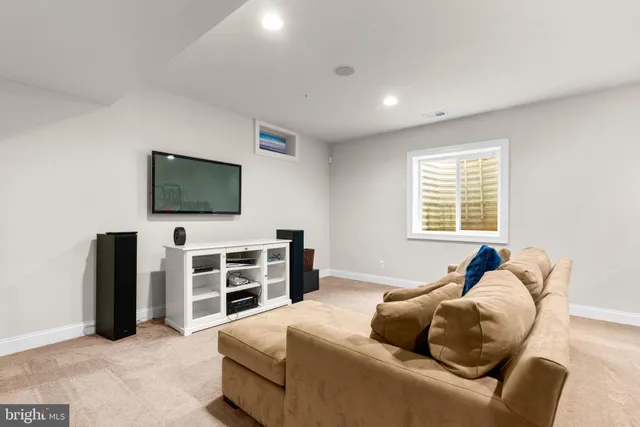 a bedroom with a bed and flat screen tv