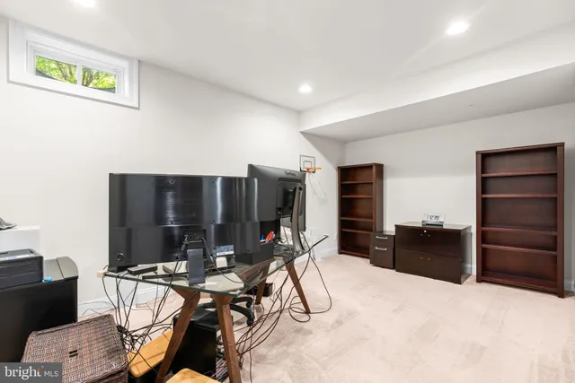 a view of a livingroom with furniture and gym equipment