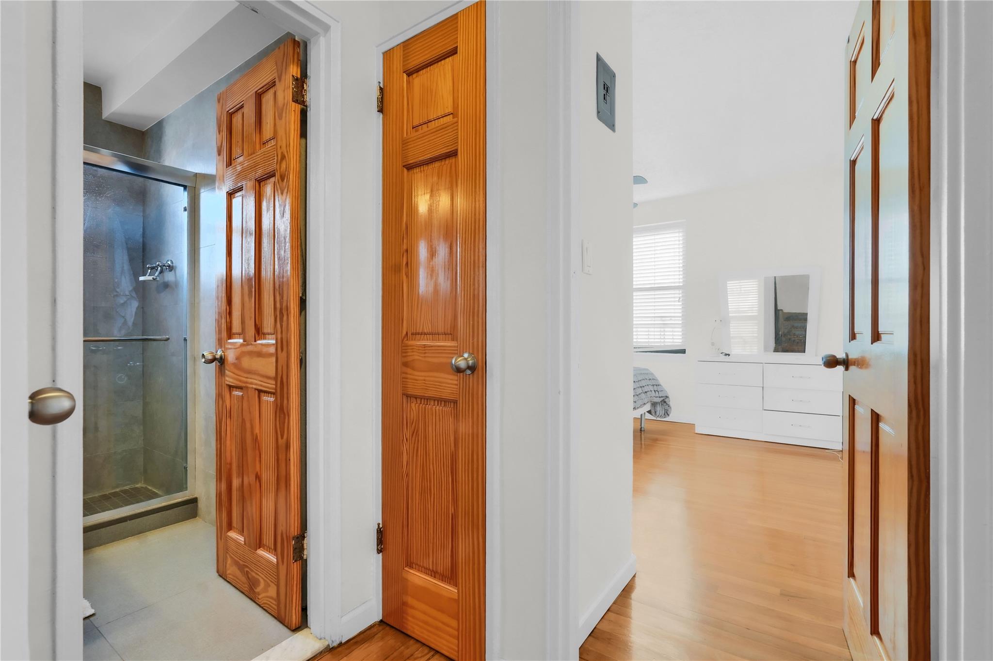 139-09 28th Road, Unit 6F Queens, NY 11354 - Photo 8 of 14 Hall with light wood finished floors
