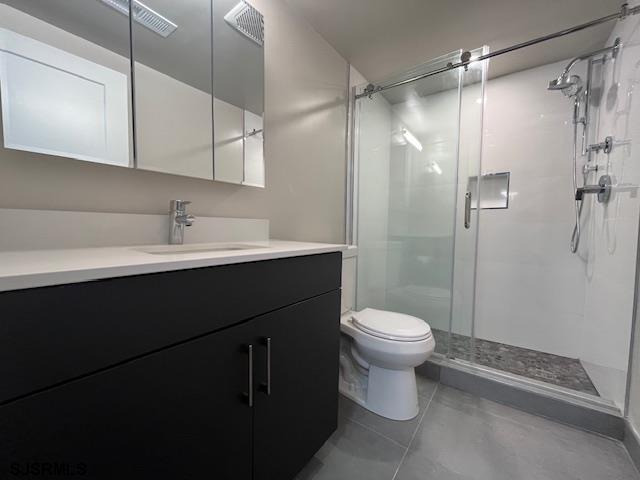 11 Shore Road, Unit 5D Somers Point, NJ 08244 - Photo 8 of 15 a bathroom with a sink toilet and shower