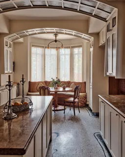 a kitchen with sink refrigerator and window