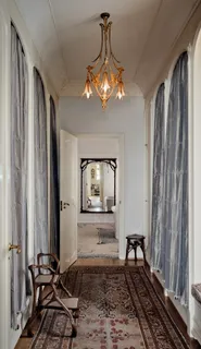 a view of a livingroom with furniture and windows