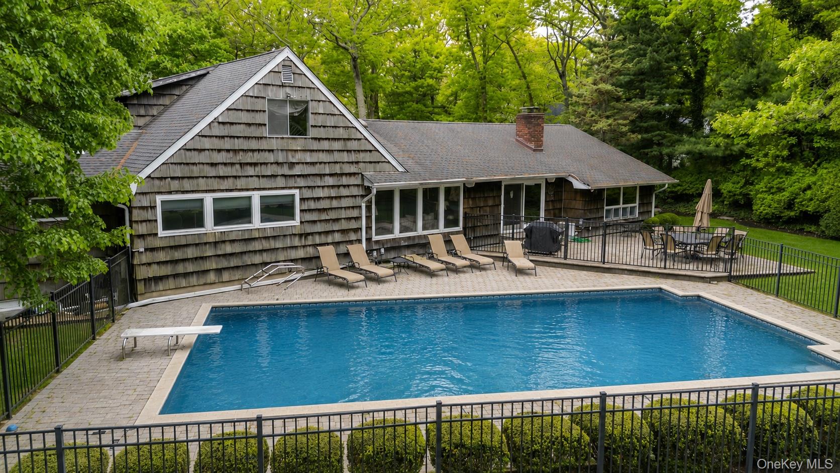 6 Apex Road Melville, NY 11747 - Photo 45 of 50 a front view of a house with swimming pool