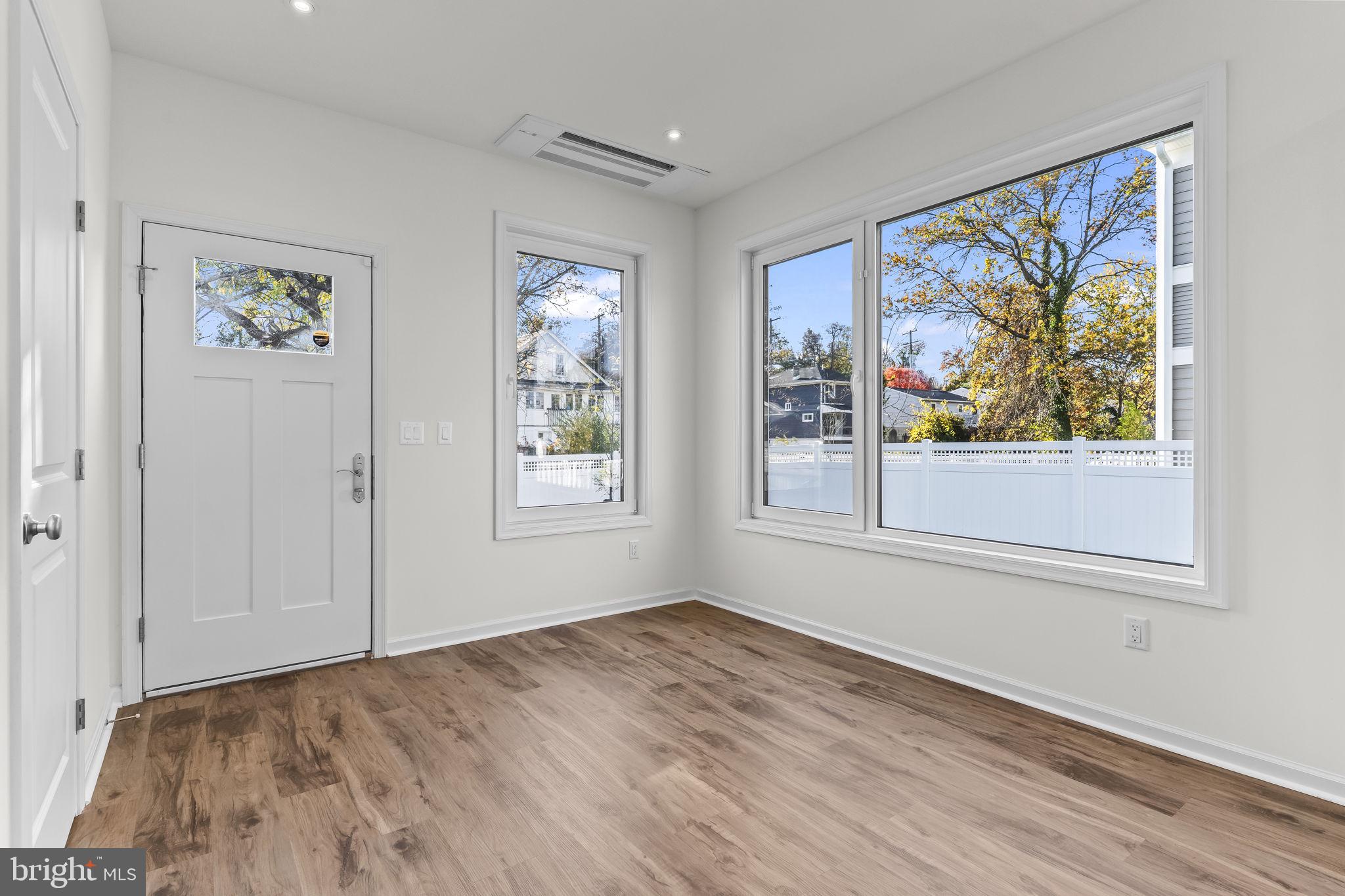 721 60th Place Capitol Heights, MD 20743 - Photo 17 of 33 a view of empty room with wooden floor and fan