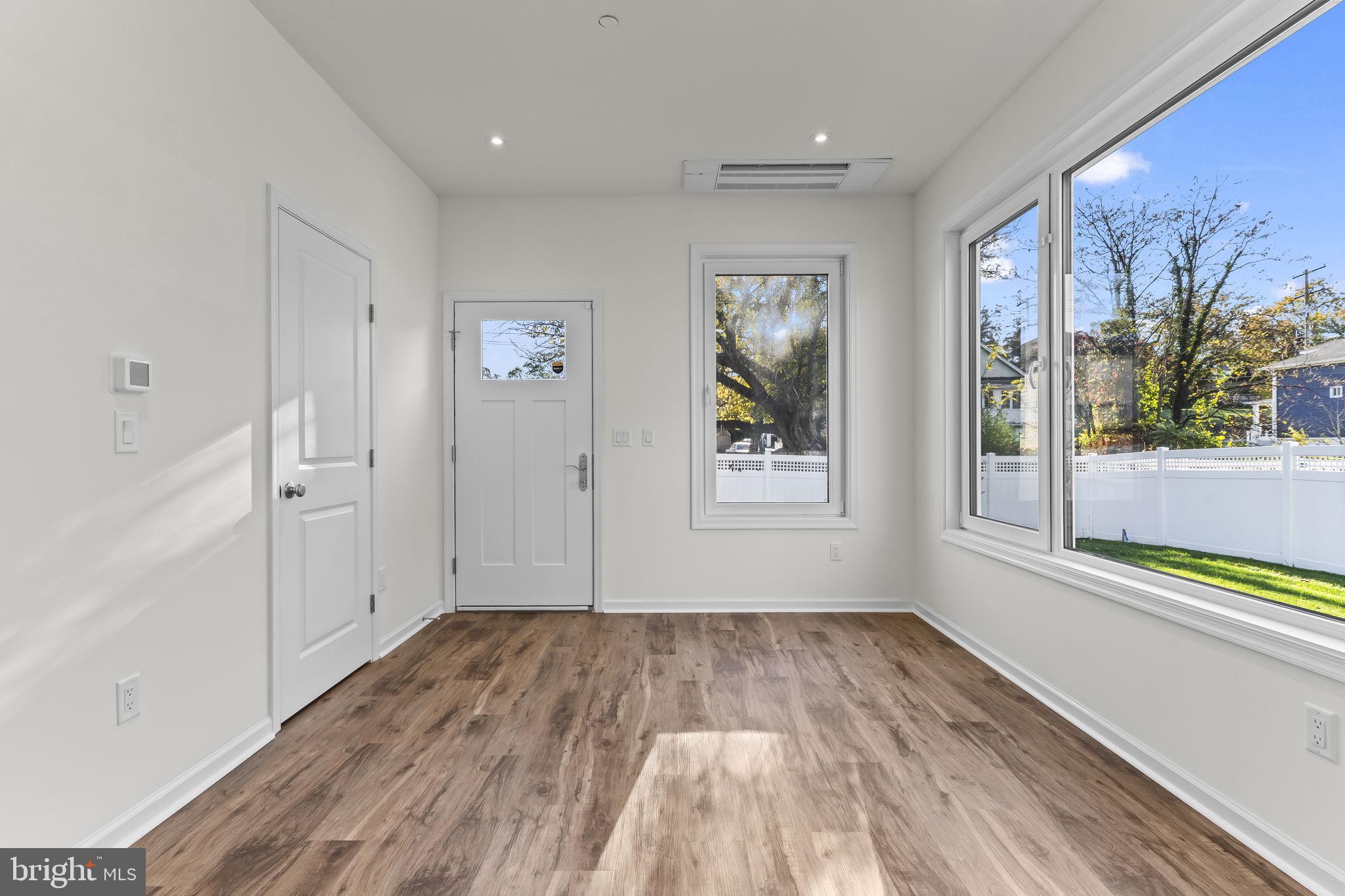 721 60th Place Capitol Heights, MD 20743 - Photo 18 of 33 a view of empty room with wooden floor and fan