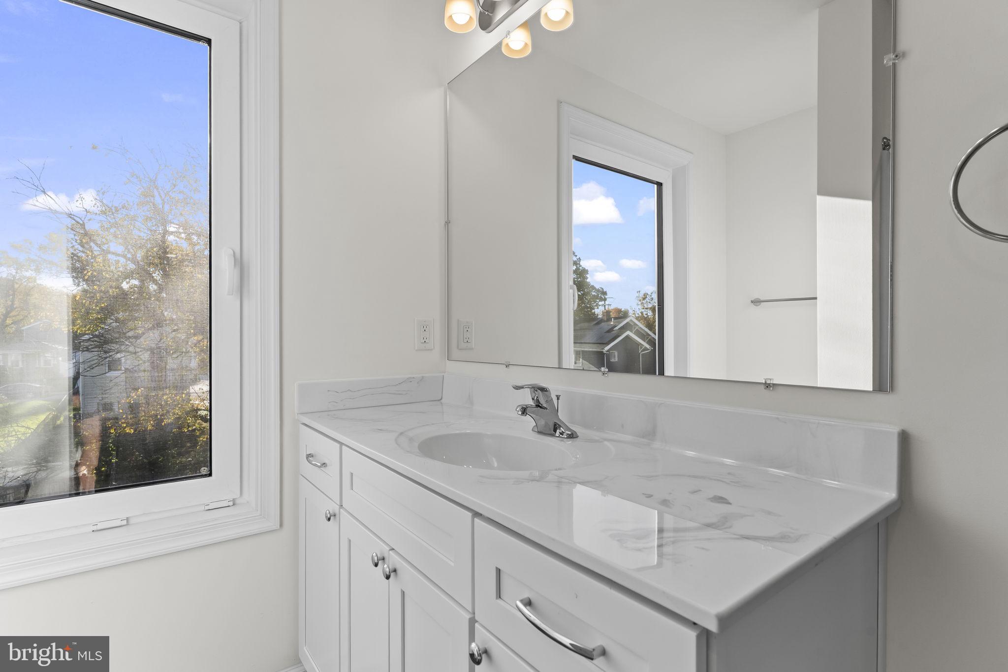 721 60th Place Capitol Heights, MD 20743 - Photo 25 of 33 a bathroom with a sink vanity and a mirror