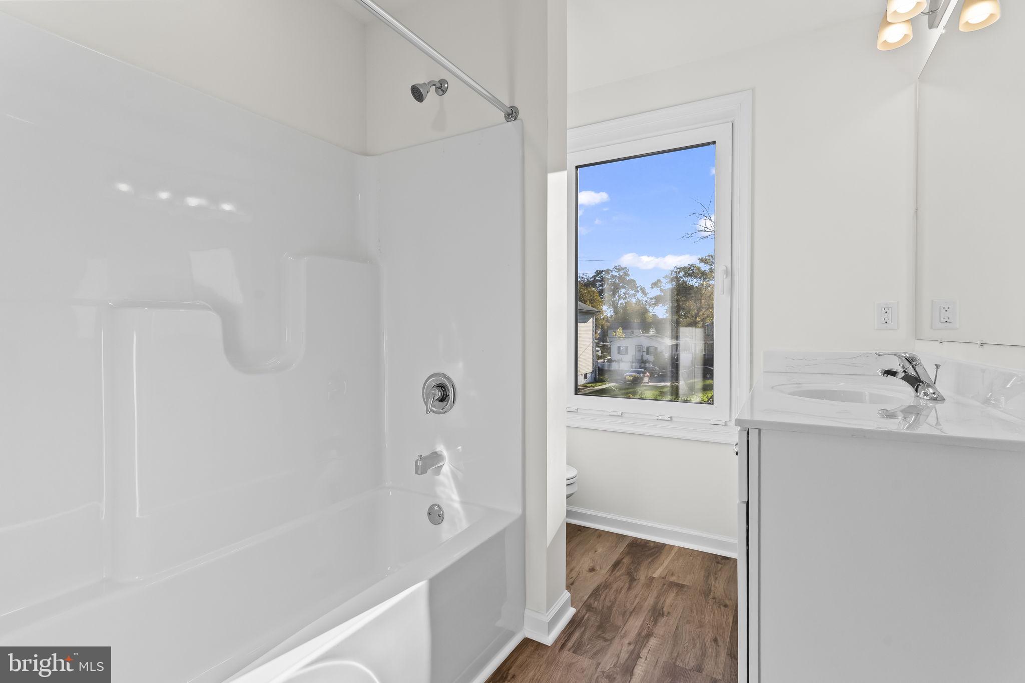 721 60th Place Capitol Heights, MD 20743 - Photo 26 of 33 a bathroom with a bathtub and a sink