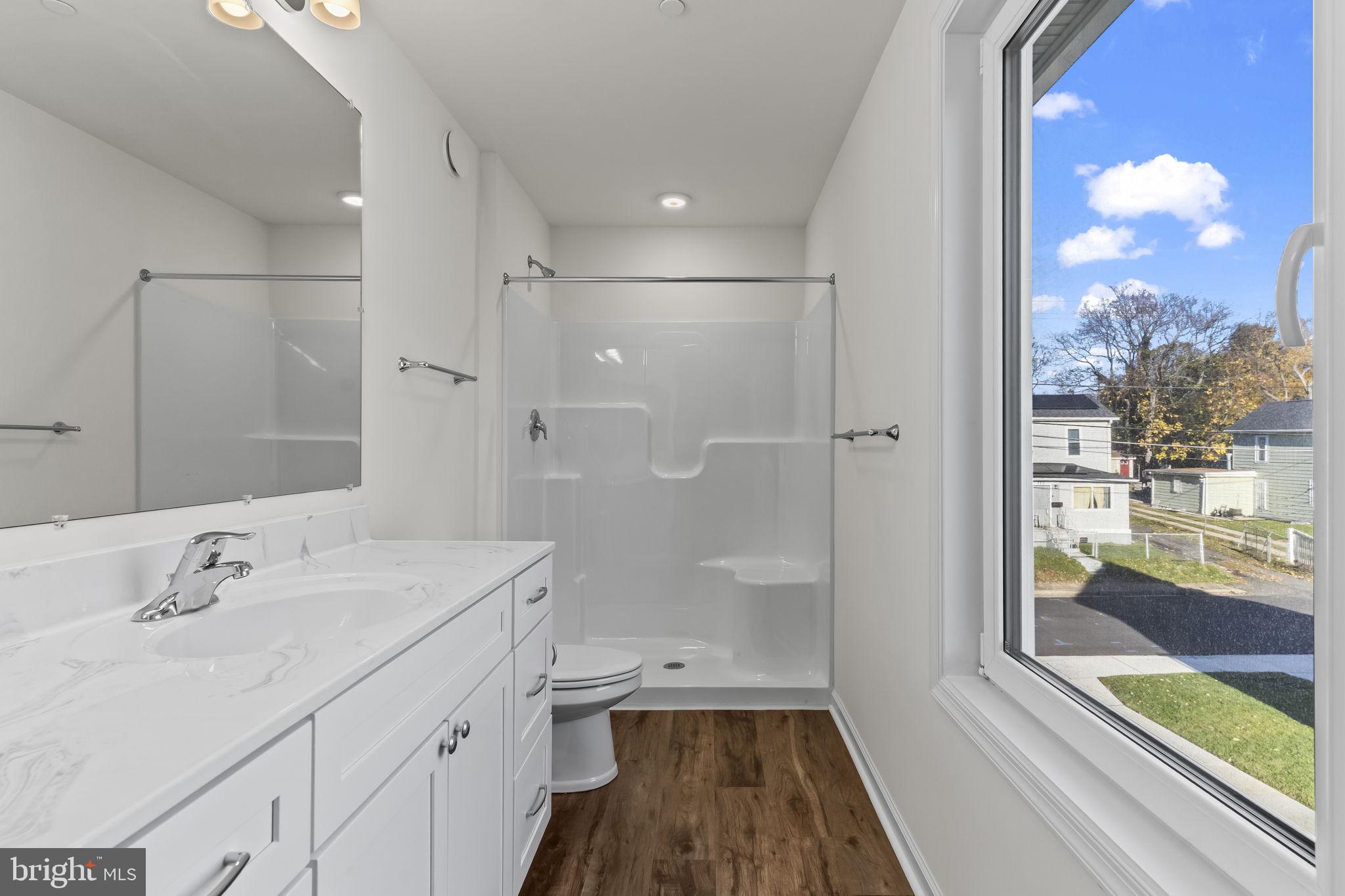 721 60th Place Capitol Heights, MD 20743 - Photo 32 of 33 a bathroom with a sink a toilet and shower