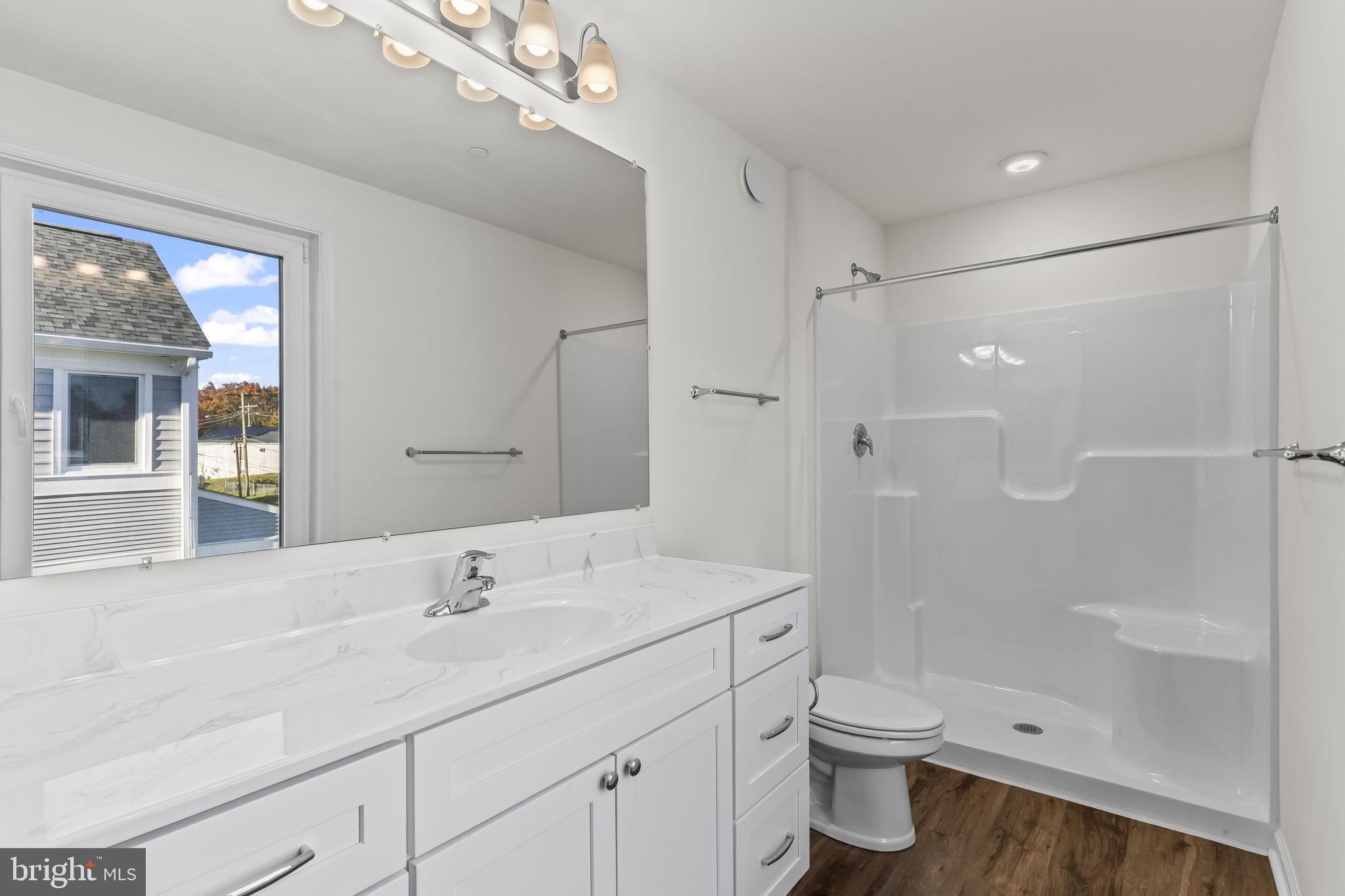 721 60th Place Capitol Heights, MD 20743 - Photo 33 of 33 a bathroom with a sink a toilet and shower