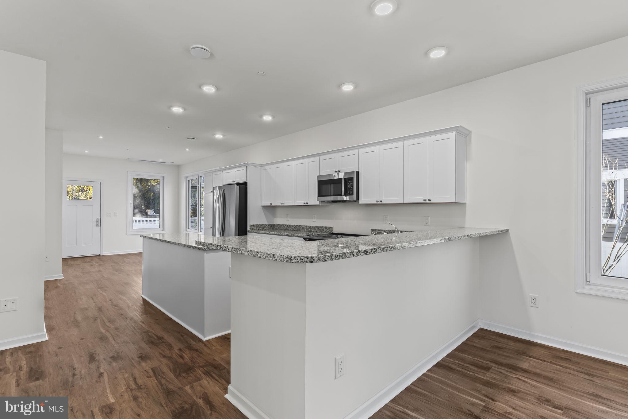721 60th Place Capitol Heights, MD 20743 - Photo 10 of 33 a view of kitchen with stainless steel appliances granite countertop cabinets and wooden floor