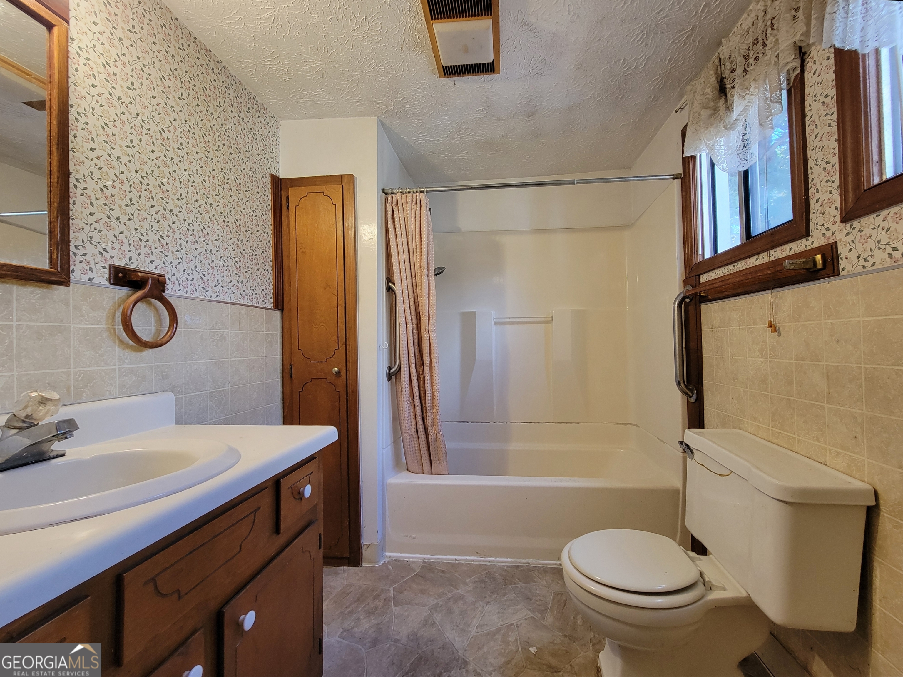 475 Bankhead Highway Winder, GA 30680 - Photo 9 of 11 a bathroom with a sink toilet and shower