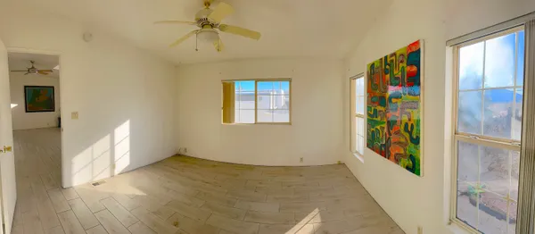 a view of an entryway with wooden floor