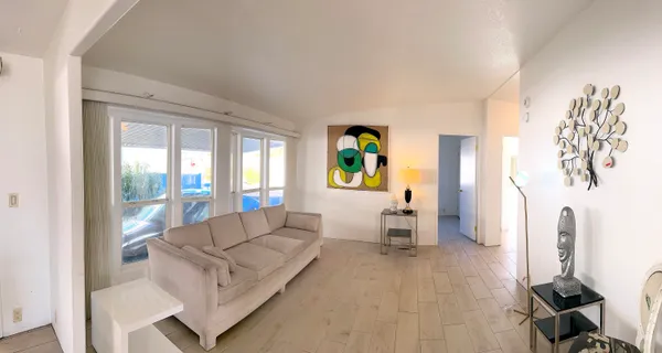 a living room with furniture and a window