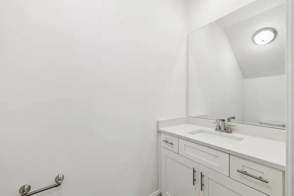 a view of empty room with wooden floor and window