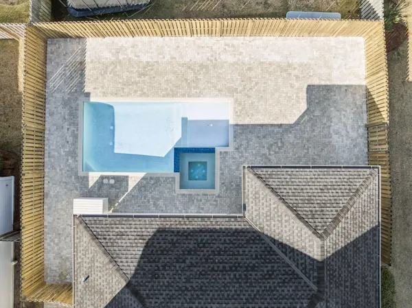 a view of house with backyard and a garden