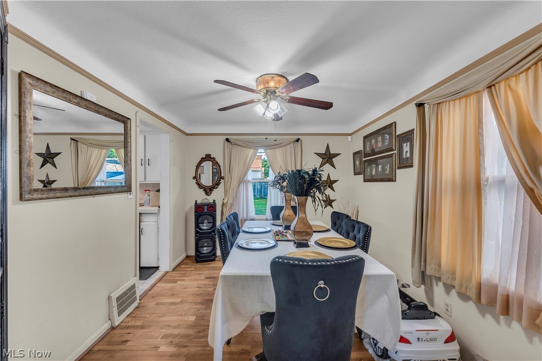 3962 Grosvenor Road South Euclid, OH 44118 - Photo 7 of 27 Dining area with wood-finish flooring and neutral wall tones
