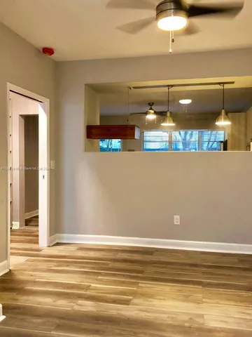 a view of a park with large trees