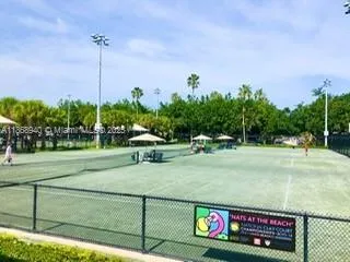 a view of outdoor kitchen and dining area