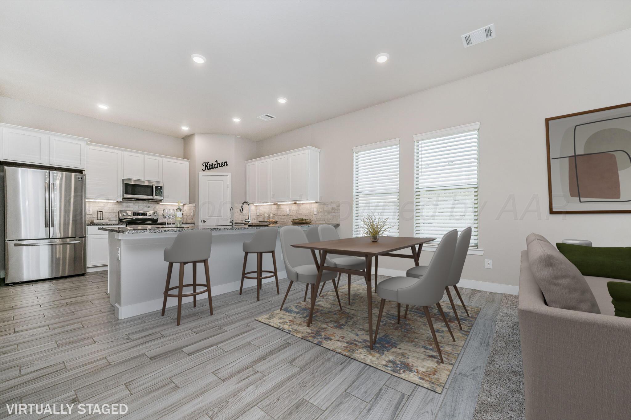 9209 Lexford Drive Amarillo, TX 79119 - Photo 5 of 23 a view of a dining room with furniture and wooden floor