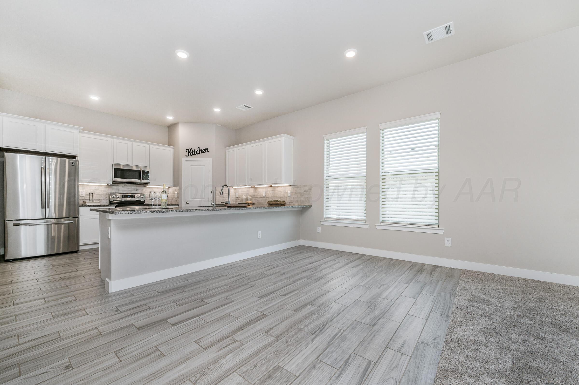 9209 Lexford Drive Amarillo, TX 79119 - Photo 6 of 23 a view of kitchen with granite countertop stainless steel appliances refrigerator sink and cabinets