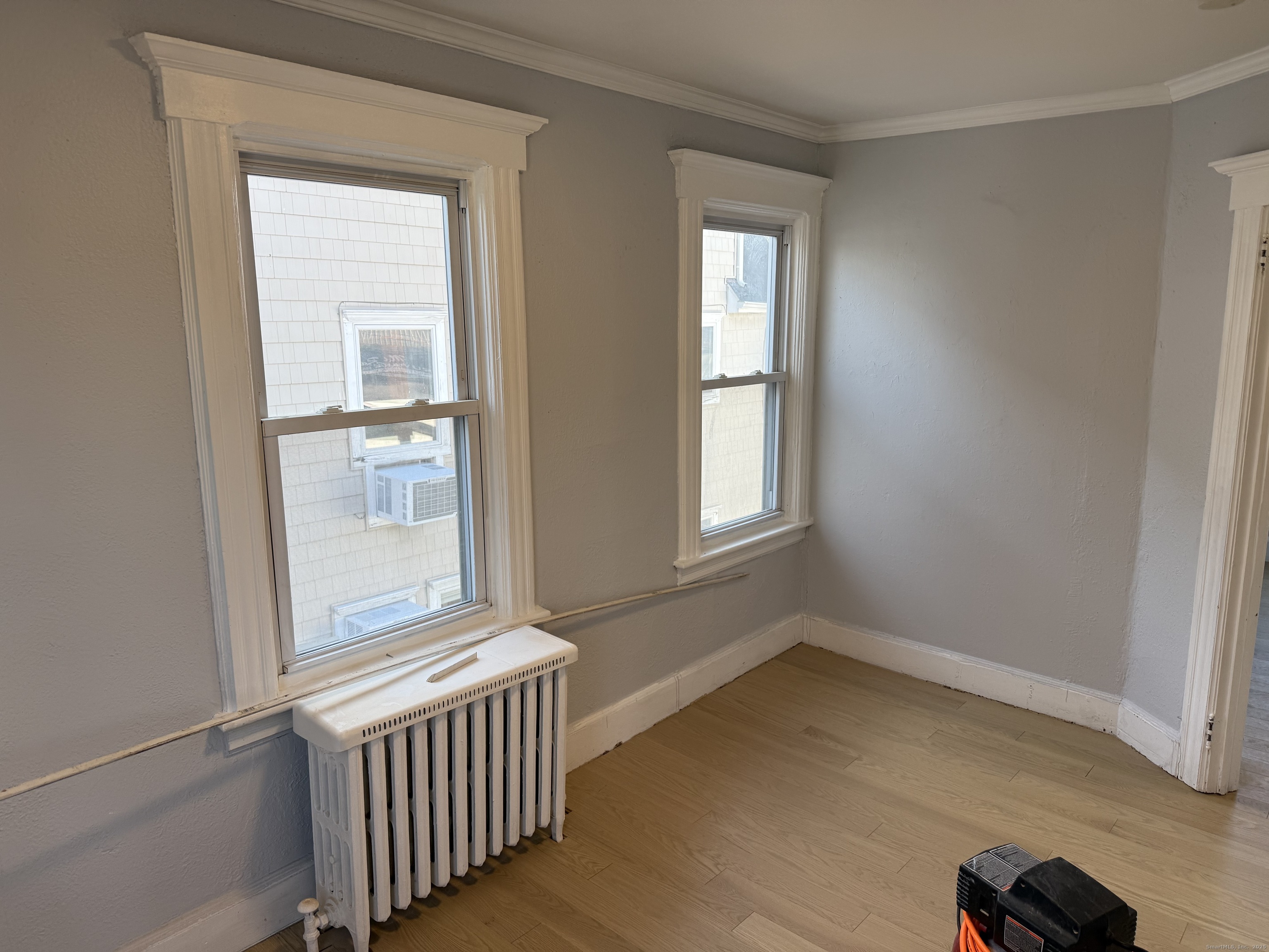 253 Hope Street Stamford, CT 06906 - Photo 7 of 11 an empty room with windows