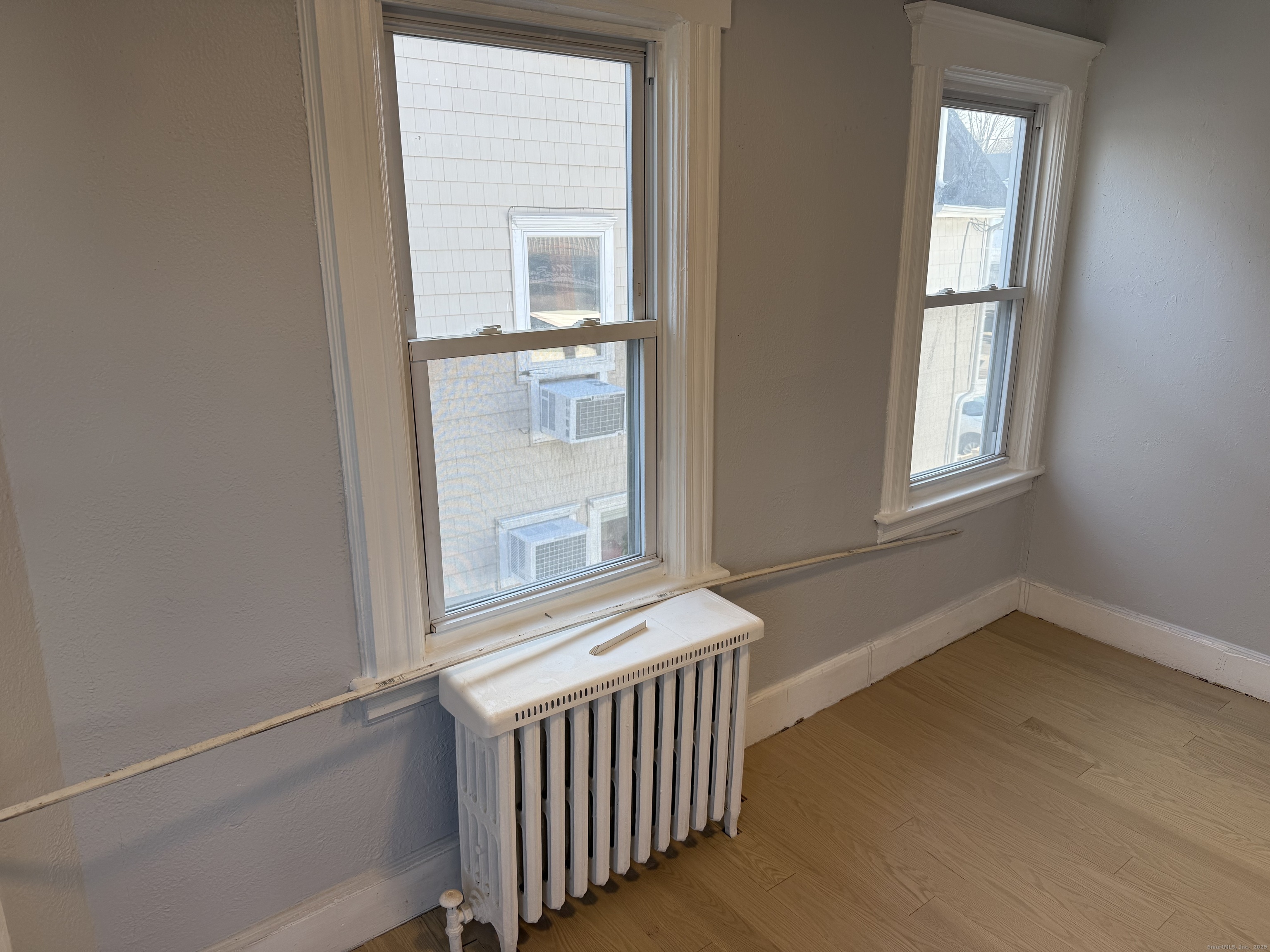 253 Hope Street Stamford, CT 06906 - Photo 8 of 11 an empty room with windows