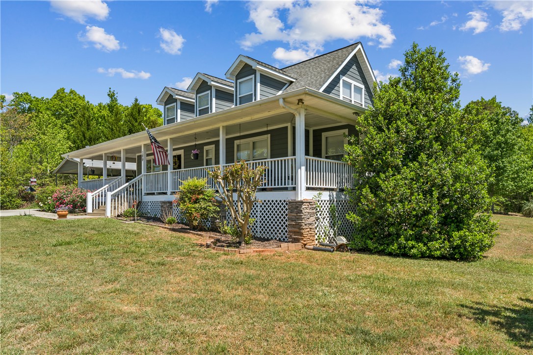 189 Little Choestoea Road Westminster, SC 29693 - Photo 2 of 38 This classic home offers a spacious covered porch, perfect for enjoying peaceful outdoor moments.