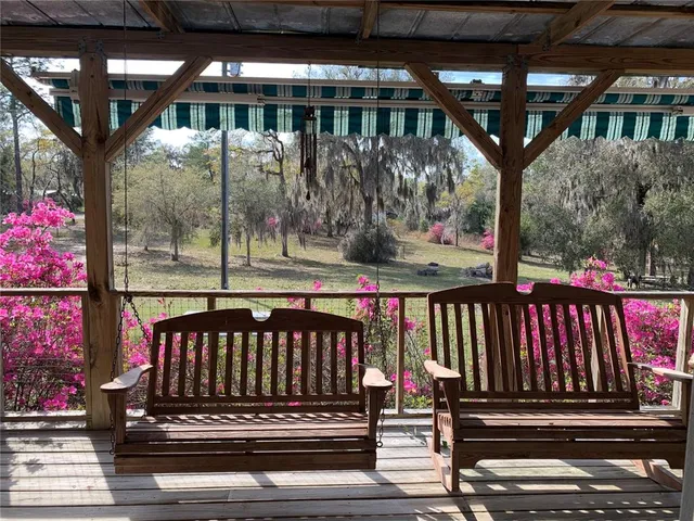 a living room with furniture a rug and a fireplace